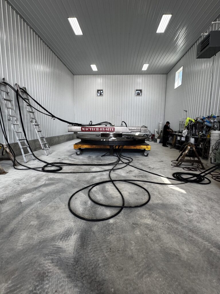 Large diameter flange prepared for on-site machining with a portable flange facer