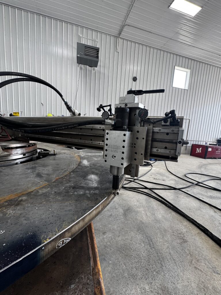 Field machinist operating a portable large diameter flange facer