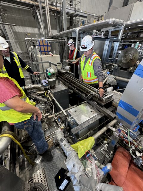 Portable milling machine set up across compressor base mounting pads for on-site machinin