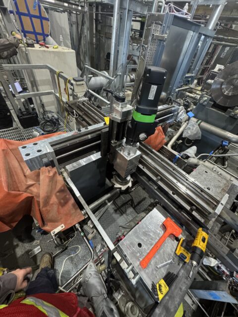 Portable milling machine positioned to machine a compressor mounting pad on-site