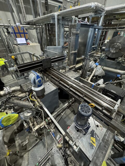 Mactech technicians using a laser tracker to establish the machining plane on compressor mounting pads